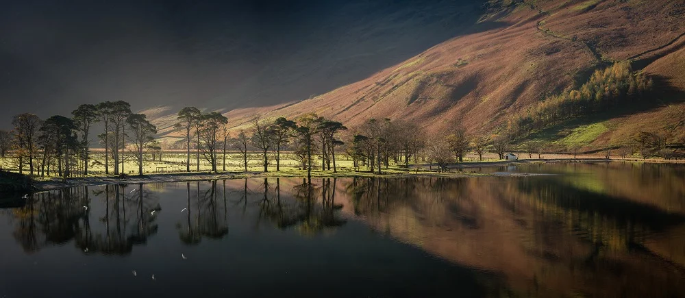 The iconic Buttermere Sentinels catching the first light. On a calm day they look incredible, and the flock of birds add a little extra dimension to the scene.