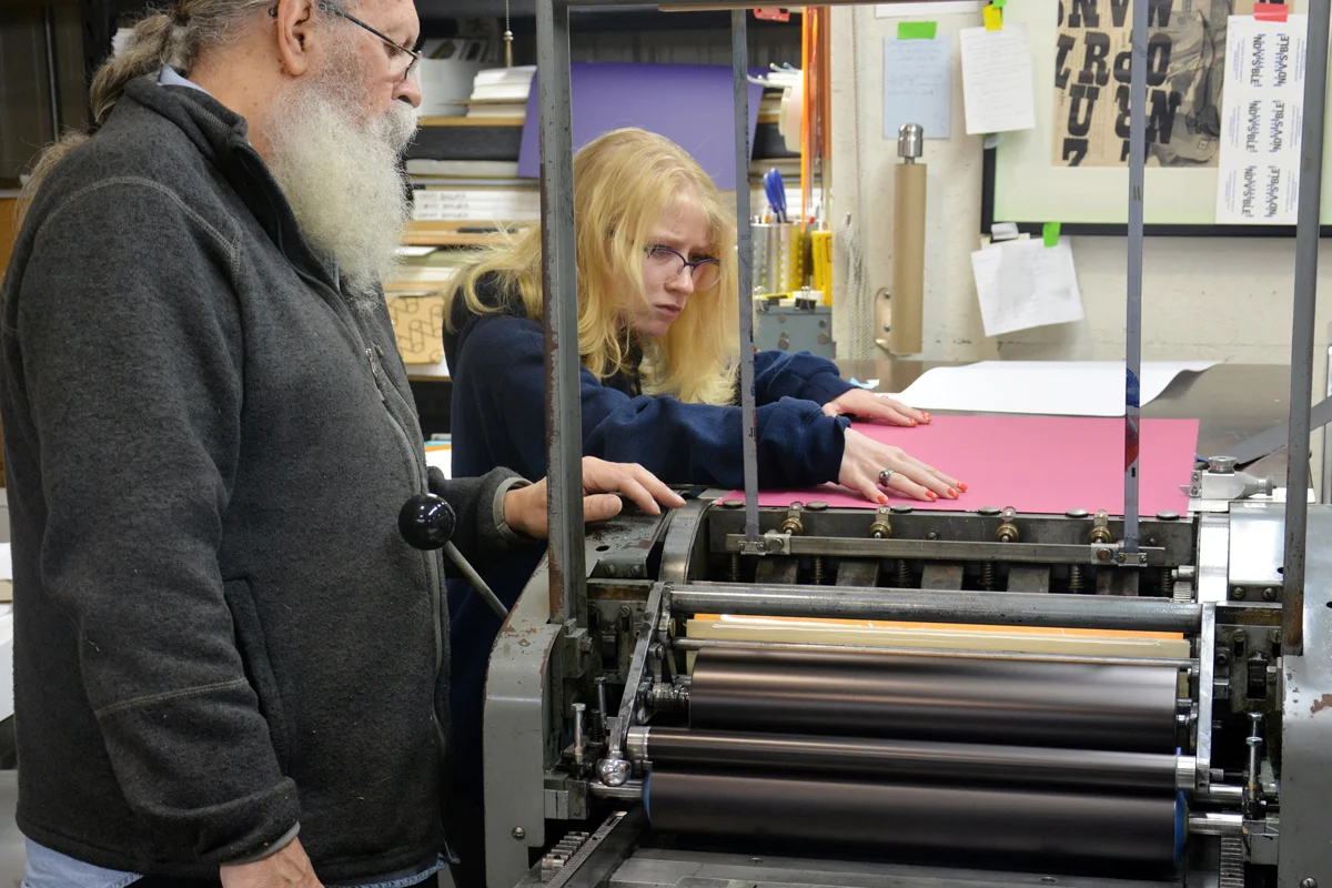 Loading the paper carefully ensures accurate positioning of the text block when printing the sheet.