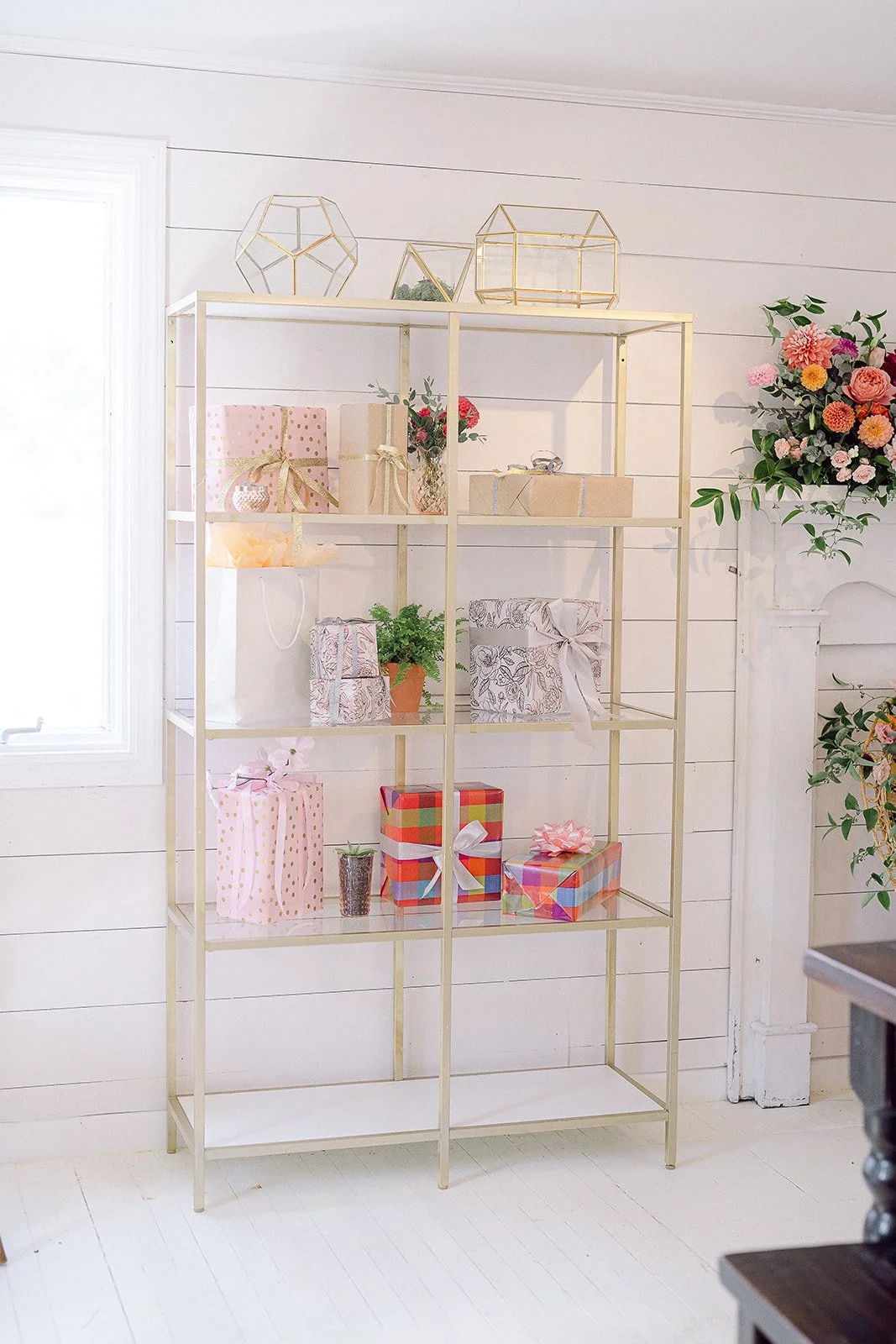 Gold Shelving to display personal moments and gifts