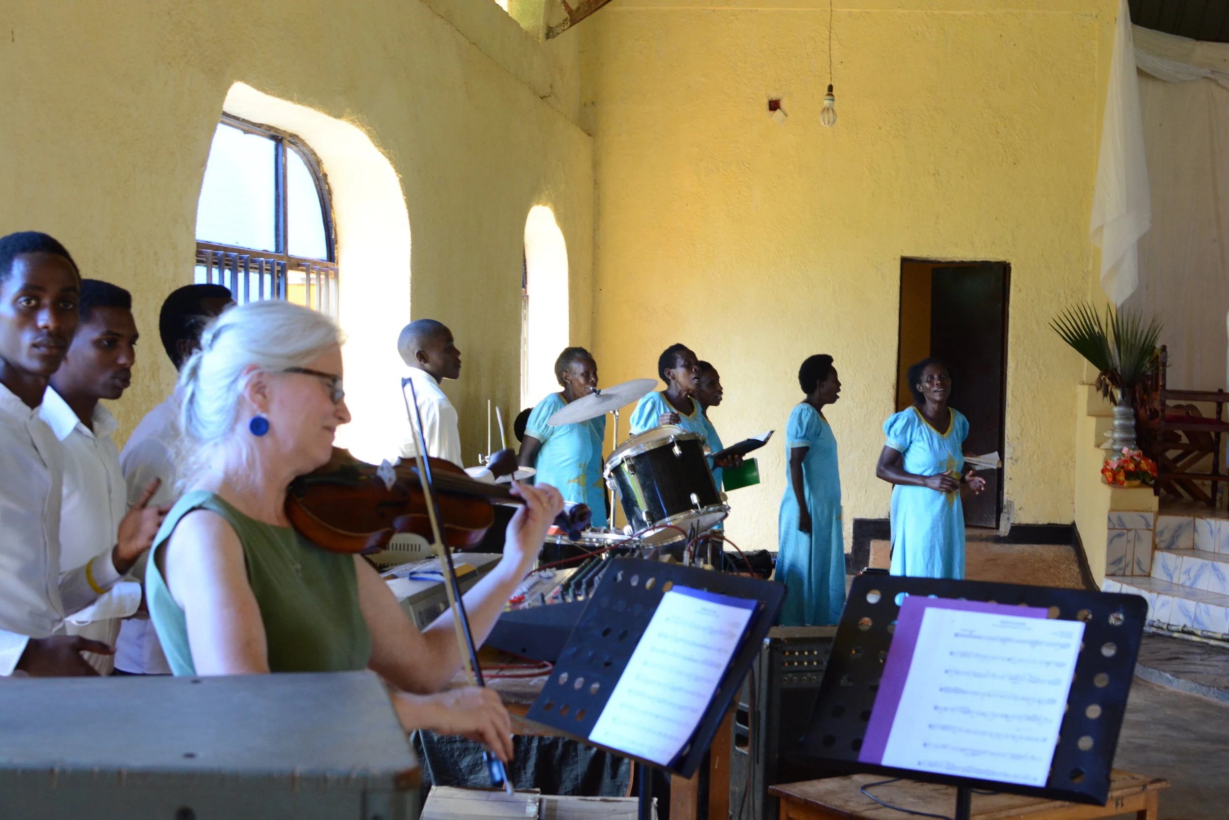 Terri Moon accompanying the singing on violin
