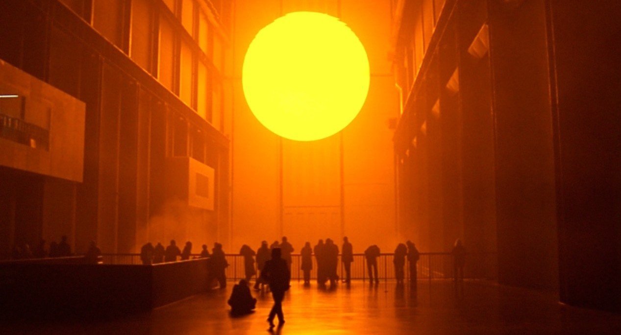  Olafur Eliasson's  The Weather Project  from 2003, in which a recreated sun and sky were made to occupy the Turbine Hall in London, England, provided a communal dystopian experience in which people lose their traditional ways of orienting themselves