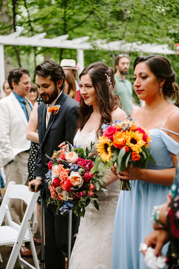My brother and sister walking me down the aisle