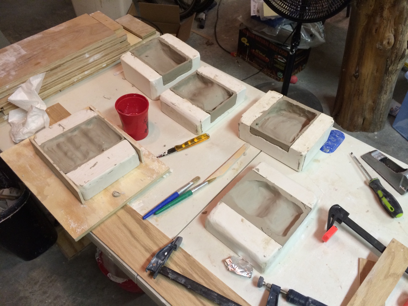 Several molds filled, waiting for the clay to dry a bit. 