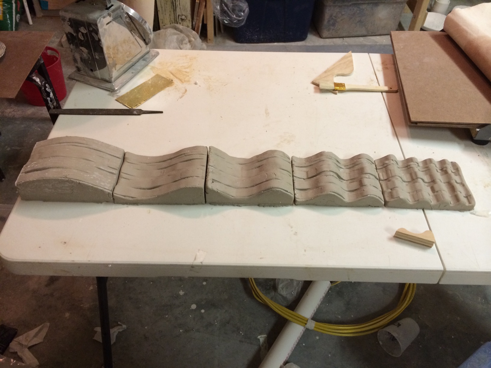 One set of tiles ready for firing. The molding process was repeated to get three sets of matching tiles.