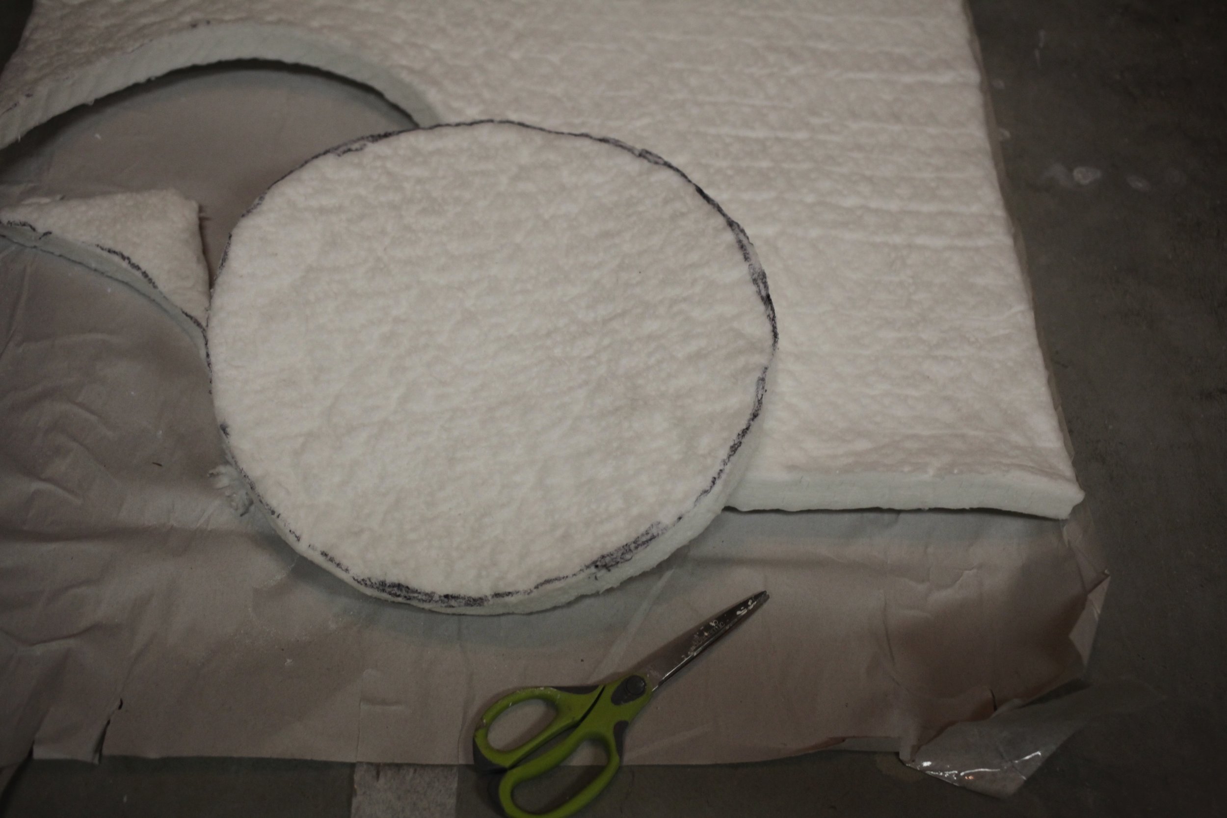 Cut circles to fit in the top and bottom of the bucket.
