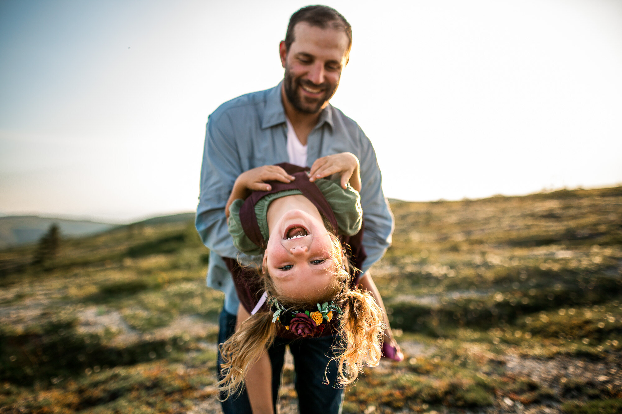 Alaska Family Photographer, father and child laughing and playing together