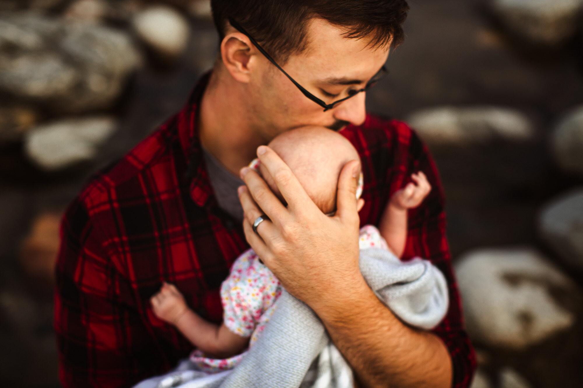 Alaska Family Photographer, father holding baby to his chest (Copy)
