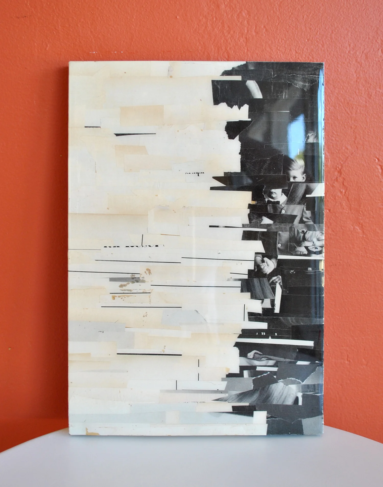 old magazine scraps on recycled particle board, coated in resin
