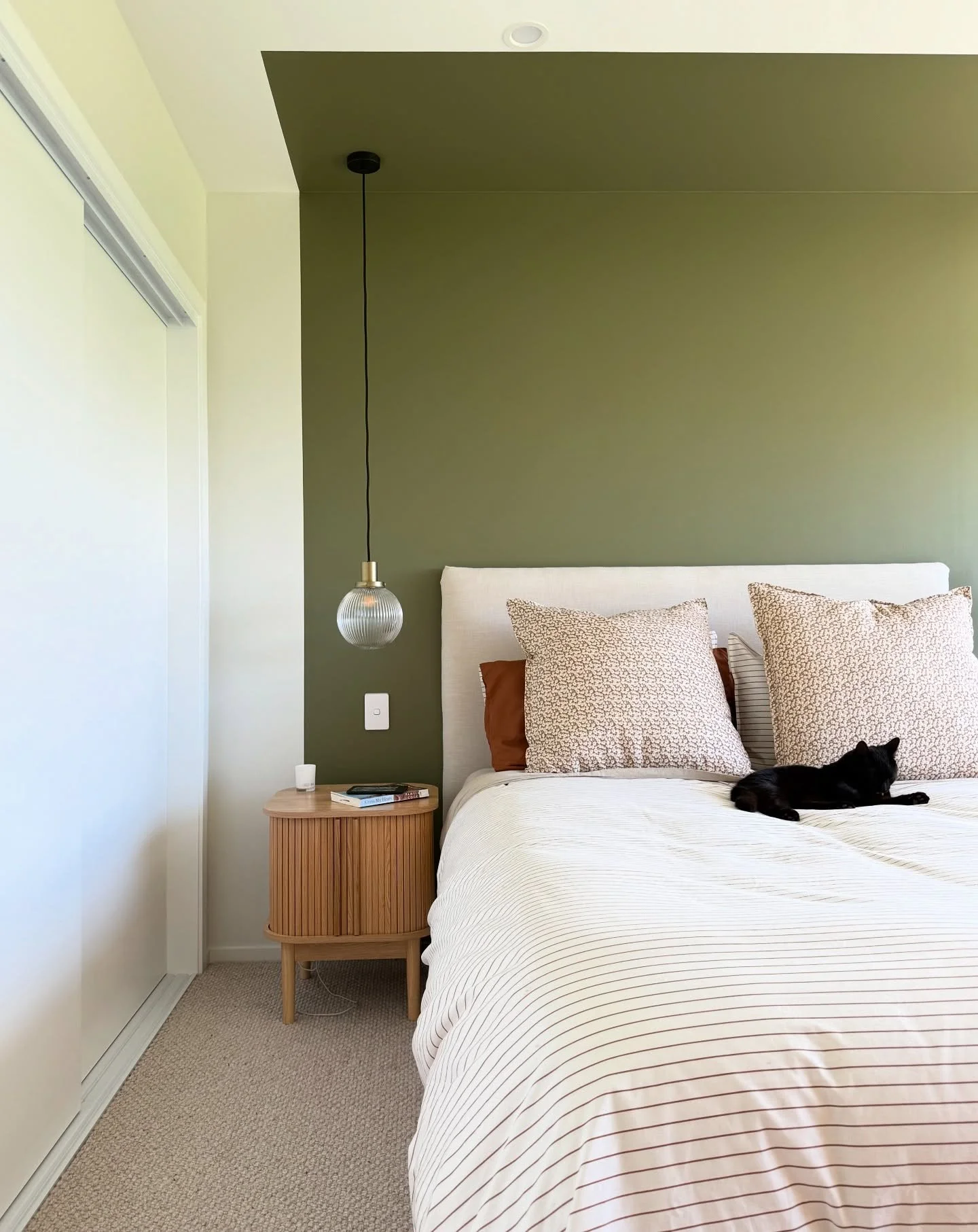 It took a decent amount of convincing to get my clients on board with colour blocking their master and stretching the paint onto the ceiling but I got them on board in the end. 

This room is completely unbalanced with the wall of wardrobes on the le