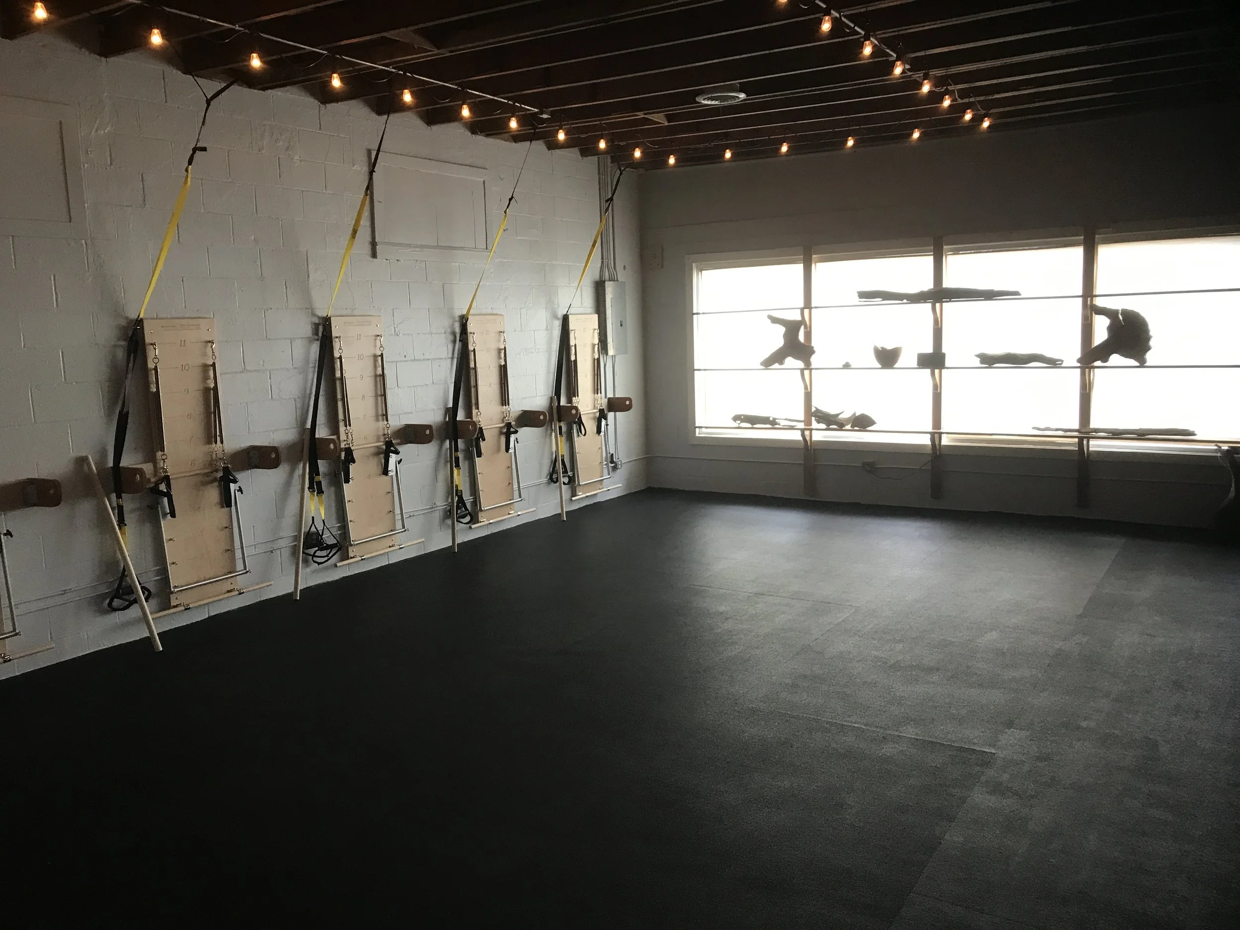 We have 10 stations for our equipment classes, each with a Balanced Body Springboard, a ballet barre, and a TRX trainer at each.