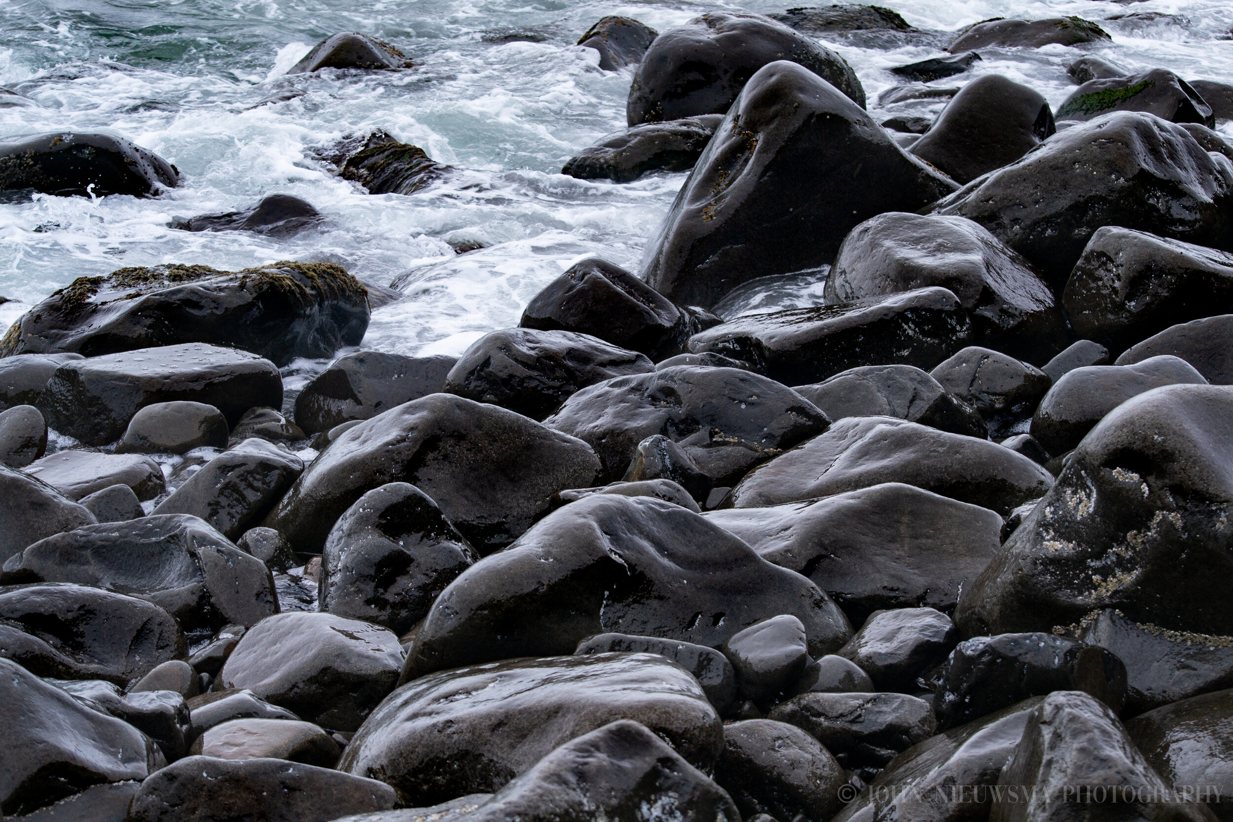 Waves Crashing Against Smooth Stones