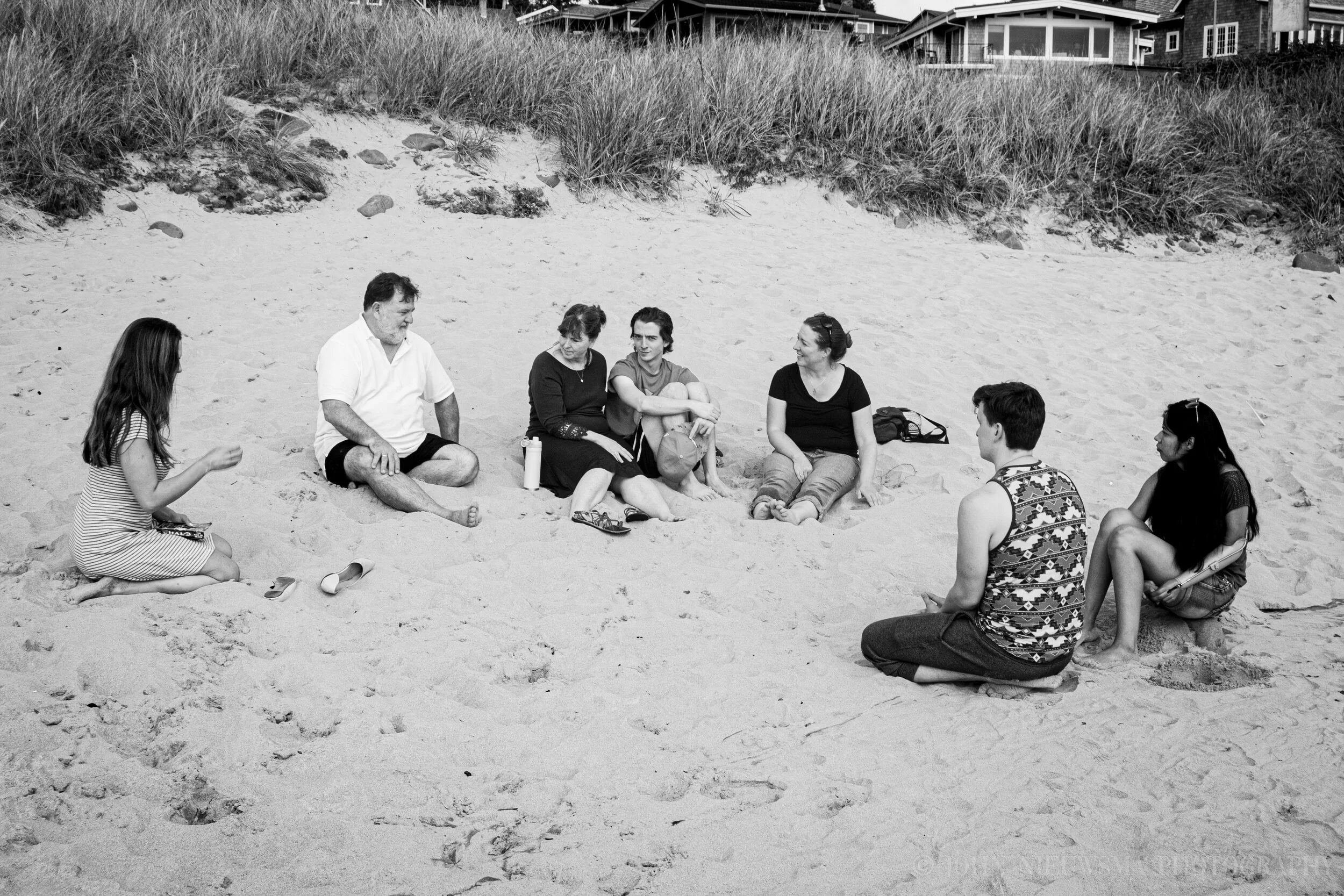 The family convenes on the sands, Andrew notices he is being watched