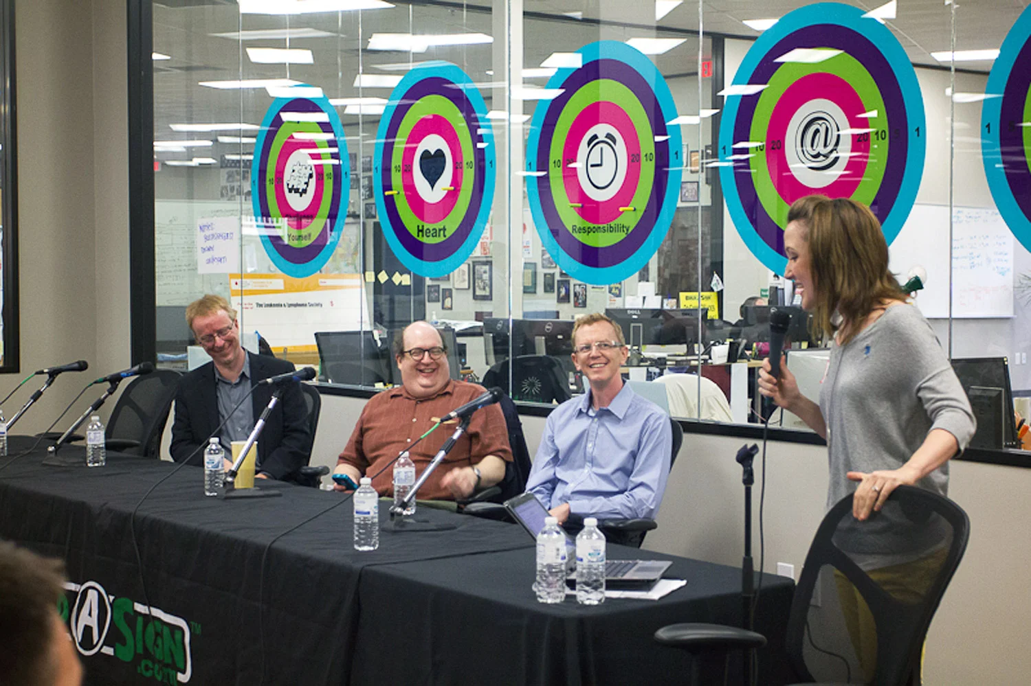 Me, moderating a panel with An Event Apart presenters an an Austin IXDA session in 2012. You can't quite see my amazing yellow pants.