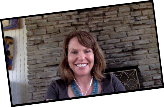 Sam smiling via Zoom, in her home in Austin, TX
