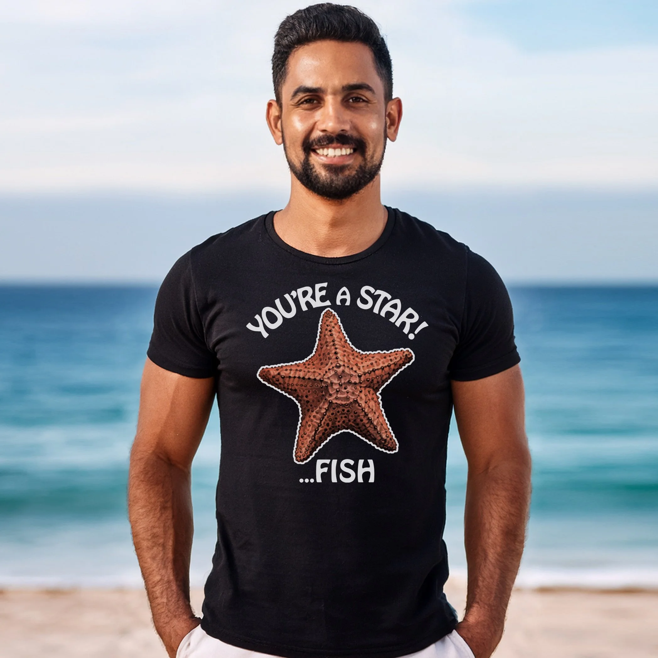 Photo of a smiling man wearing a Black T shirt Design of a Starfish with the phrase "You're a Starfish"