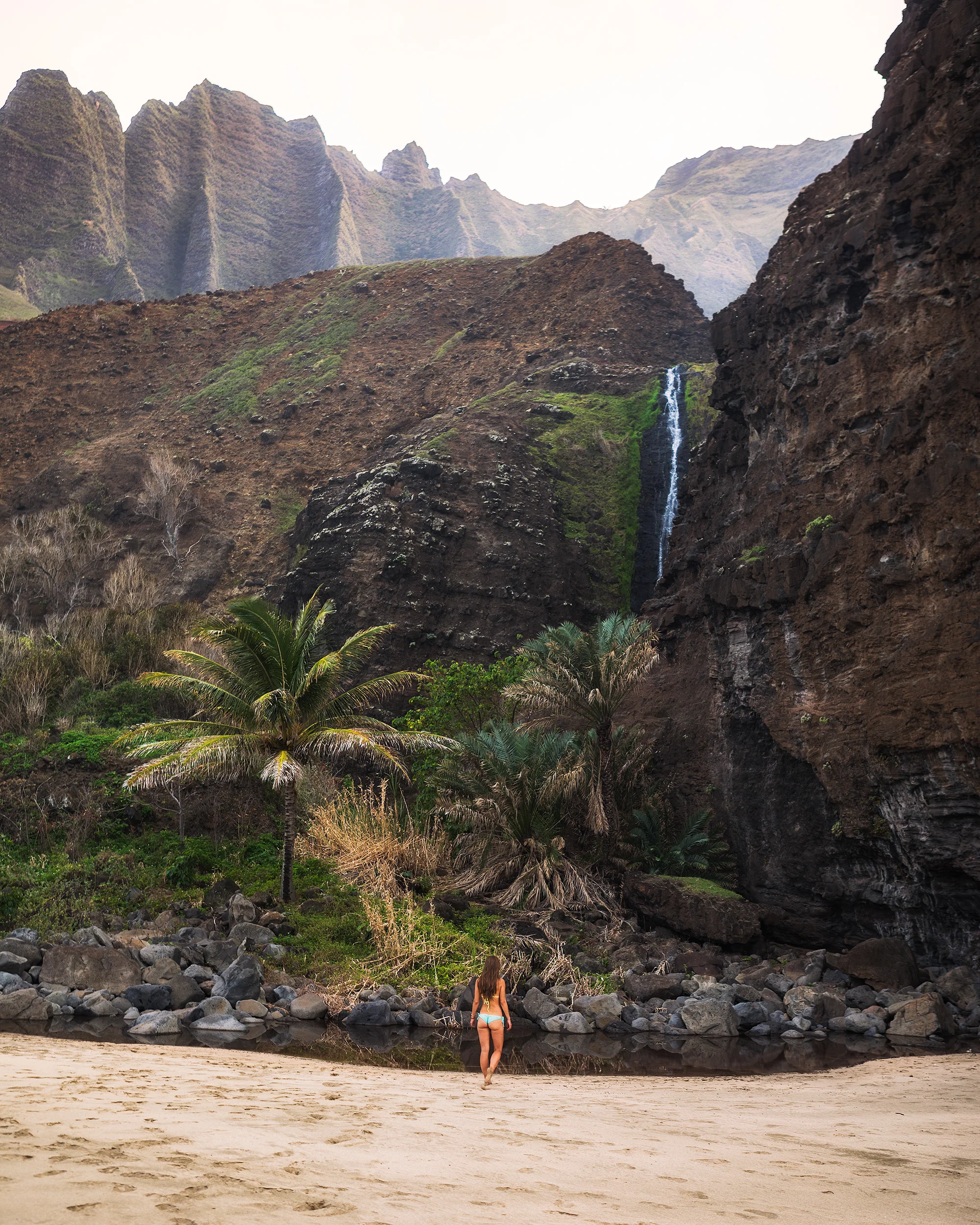 Andrea-at-the-Waterfall-at-Kalalau-Beach-by-Michael-Matti.jpg