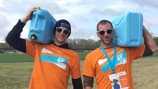 Pictured Above: Kevin Nelms and Brandon DeYoung carrying the Jerry cans to demonstrate how far the average person in a developing country has to carry water. Water that is often dirty and disease ridden.