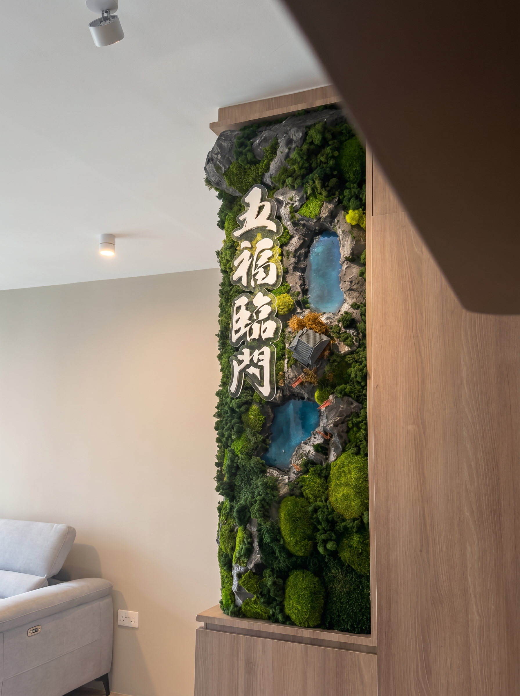  A Japanese-inspired preserved moss installation featuring a miniature temple nestled within lush landscapes, accented by handcrafted resin water bodies that mimic natural ponds and vibrant autumn trees that beautifully complement the warm wood inter