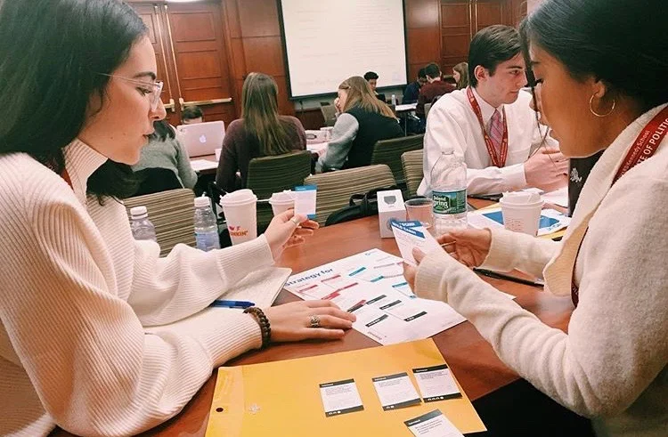Pam Armas ‘20 and Gabrielle Salko ‘21 laying out a plan for Marist to increase engagement.