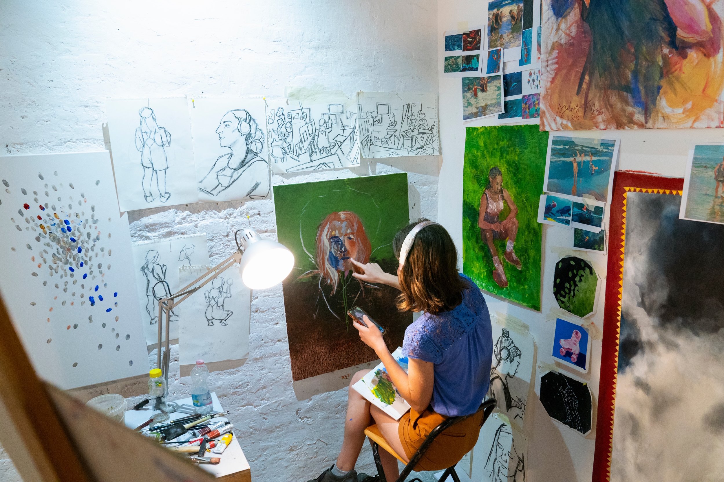 Kysar painting in her studio space