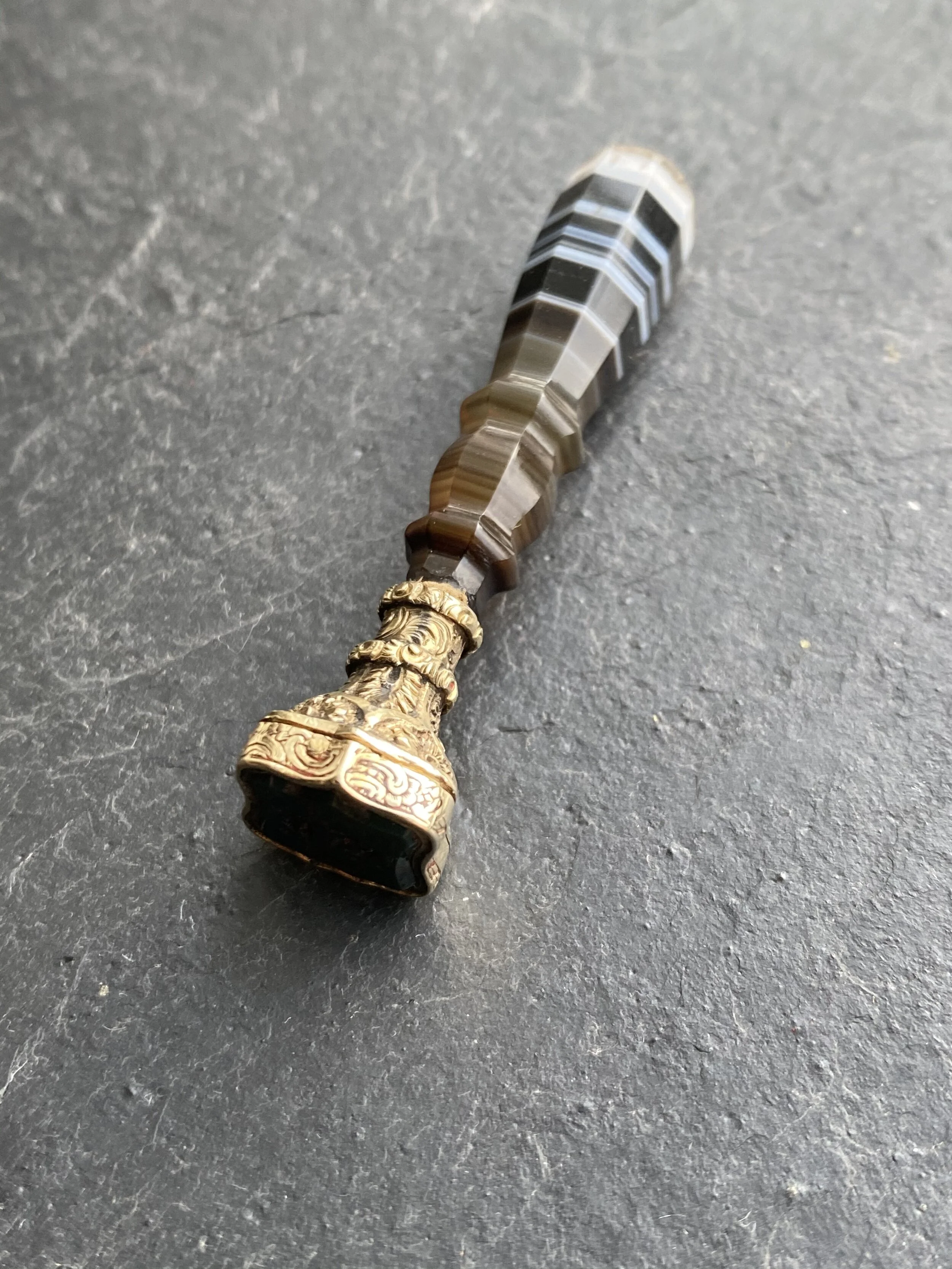 Banded agate hidden compartment initial seal 