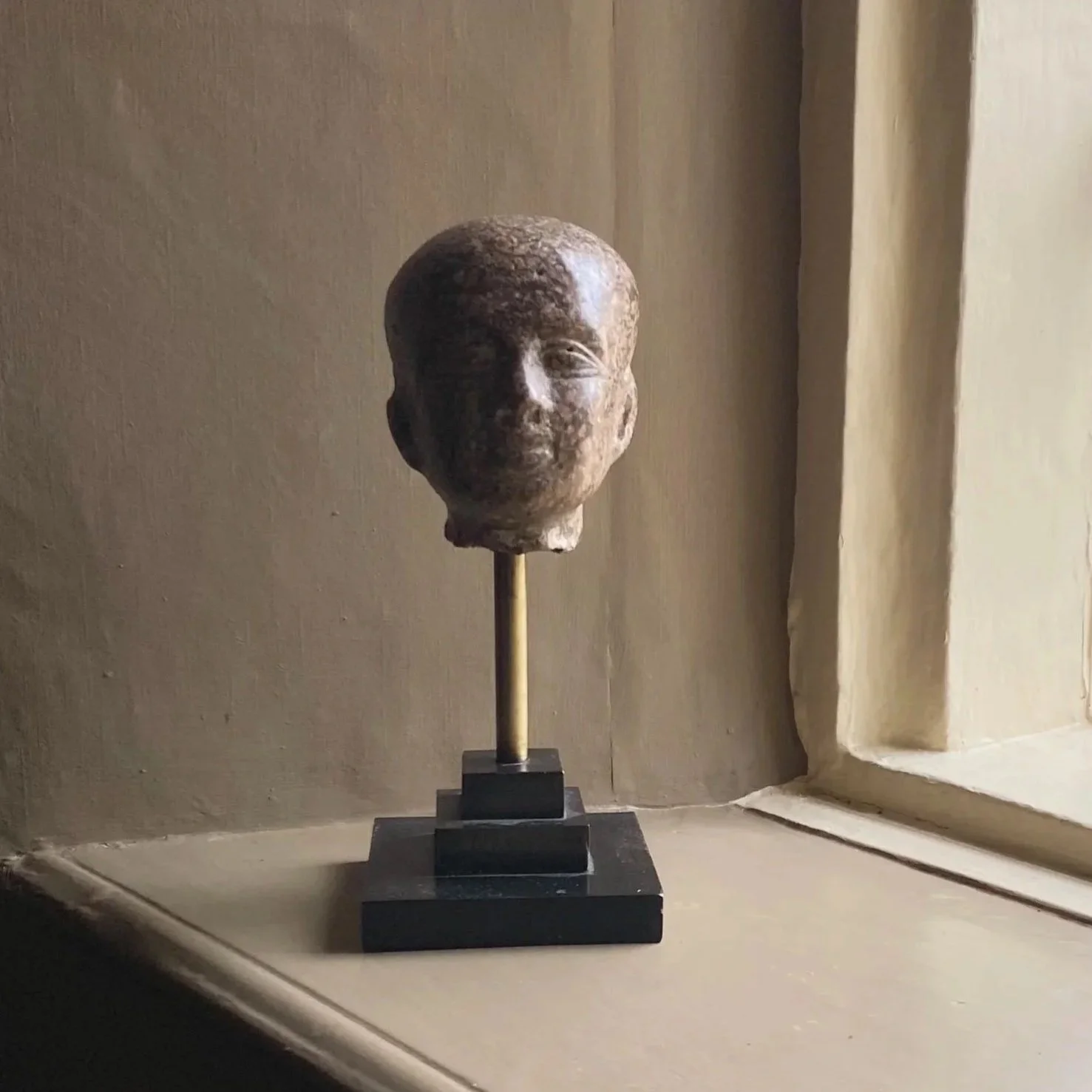 Museum Copy of an Egyptian Bust on Plinth