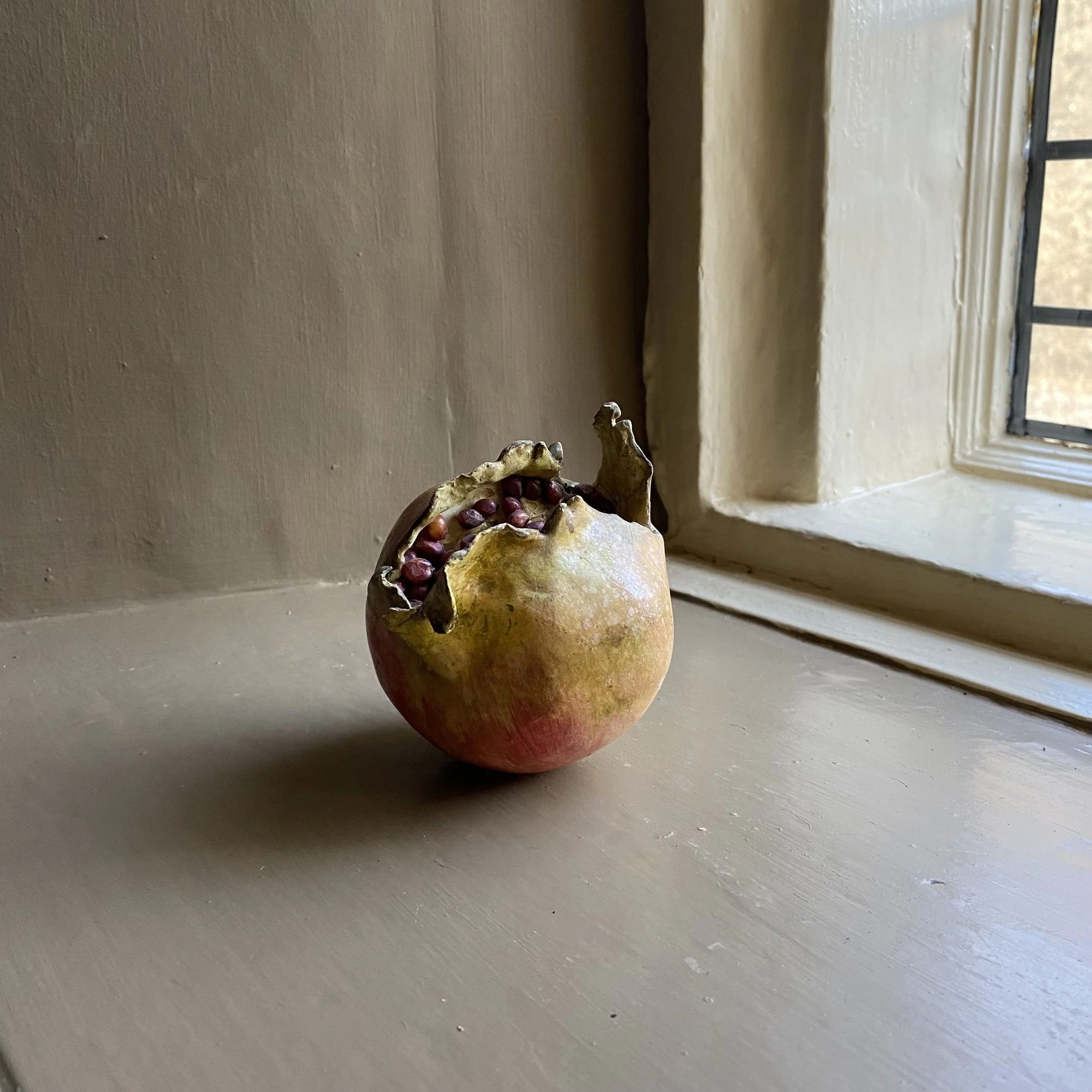 Realistic Study of a Pomegranate in Painted Plaster