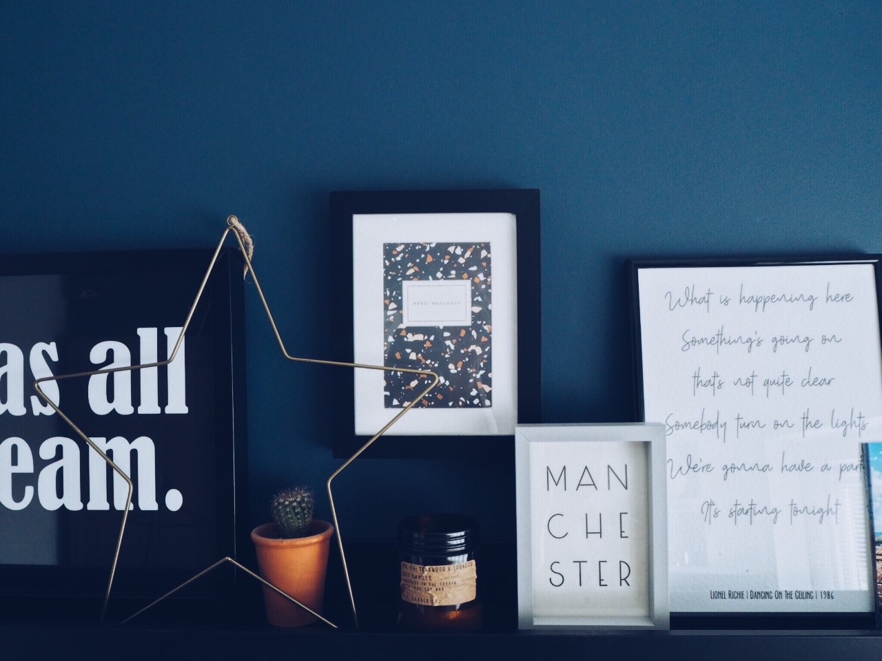 Merci Beaucoup & Manchester cards framed. 