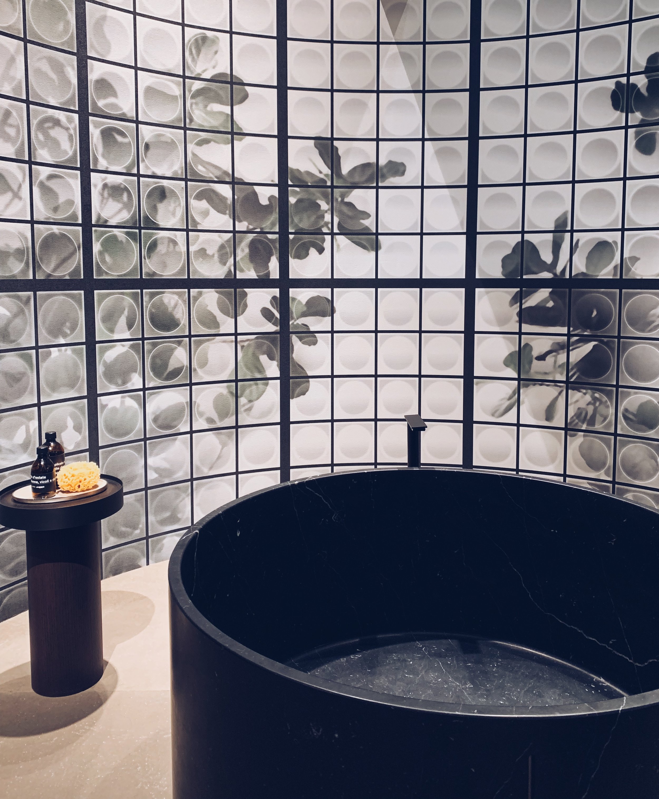 Agape & Wall&Deco, Salone Del Mobile. Black round bath and statement wallpaper in the bathroom.