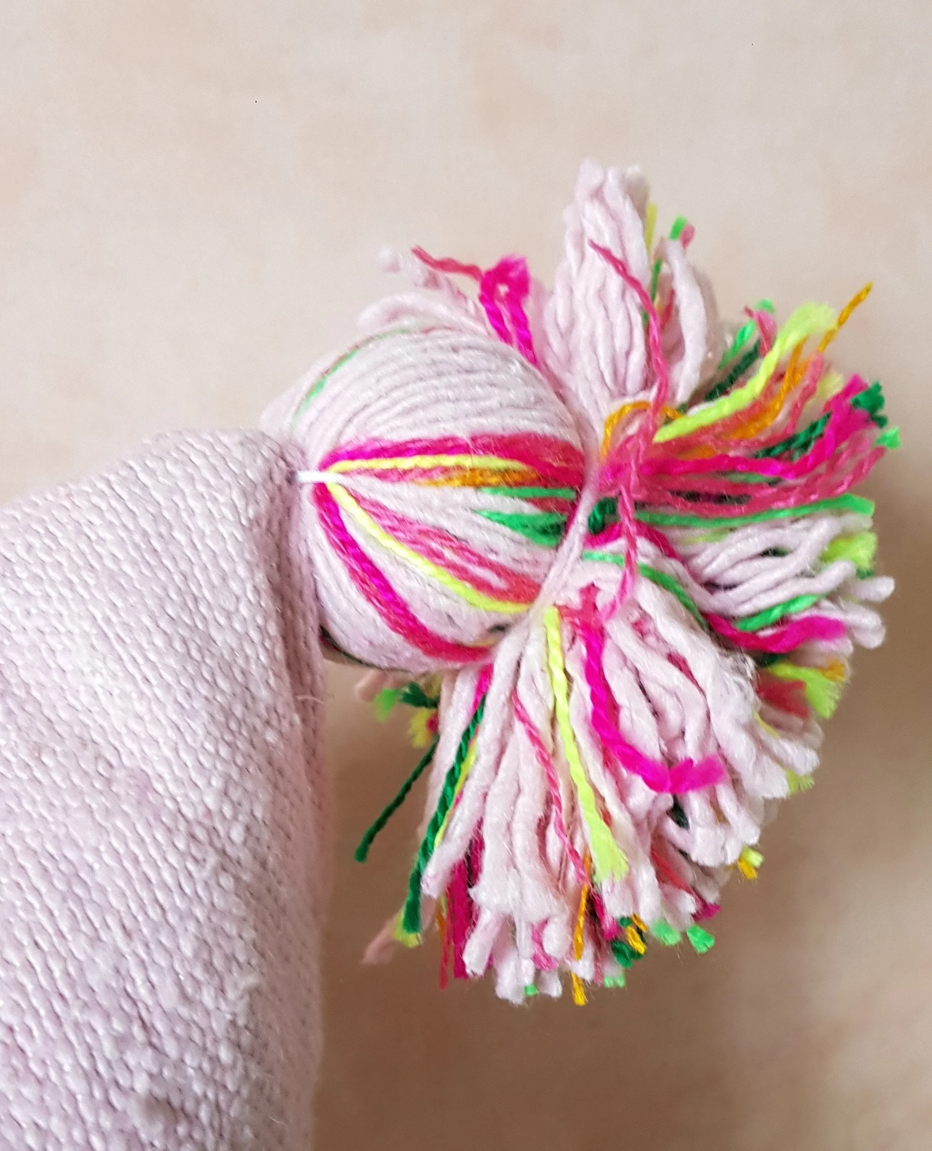 Pink rainbow pom pom.jpg