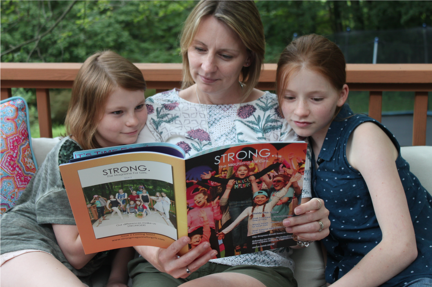 Me with my daughters, Daisy and Lucy, reading the first prototype of STRONG