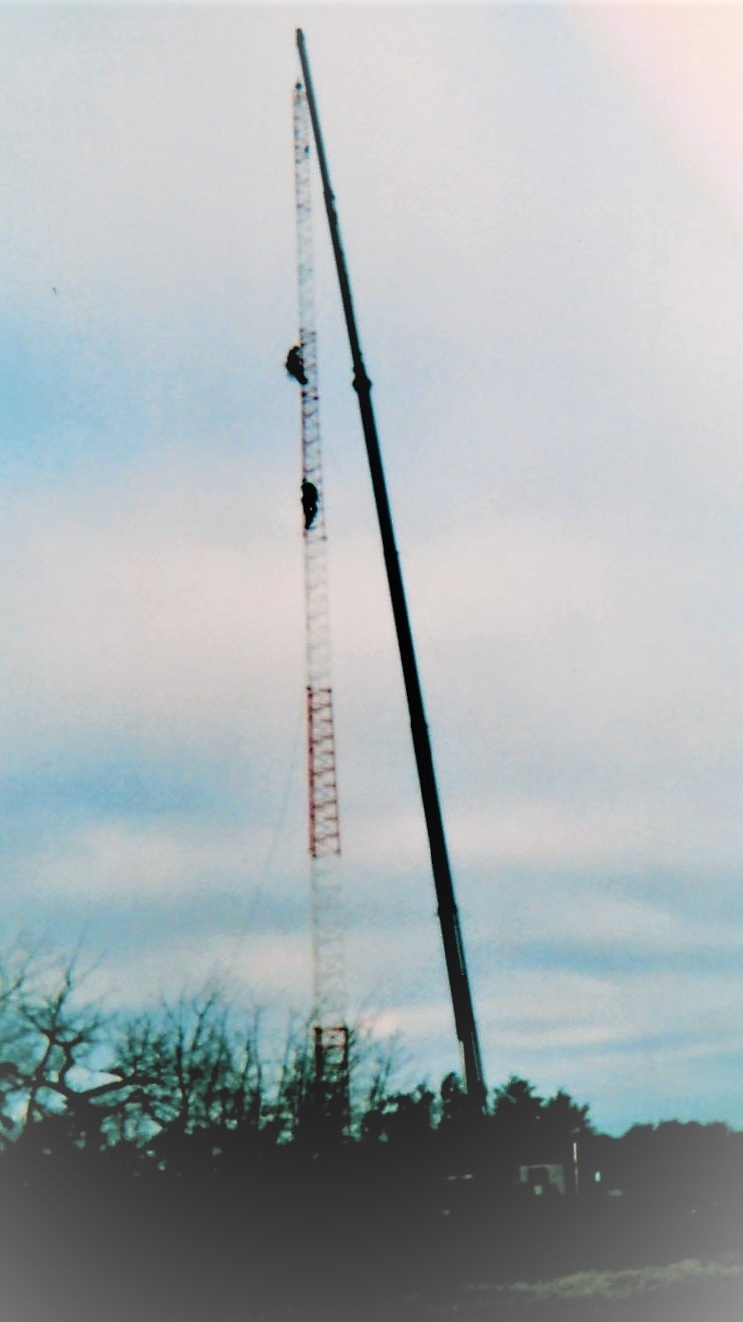 2004 - 30 ton picker holding 165’ tower