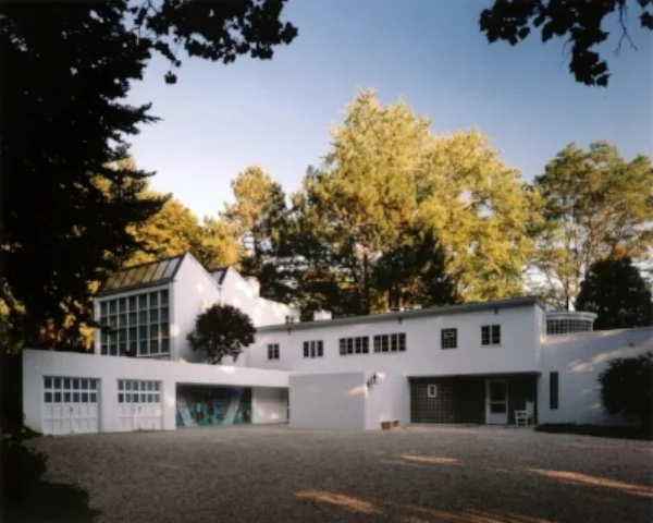 Frelinghuysen Morris House & Studio with the Studio in the upper left and a fresco by George L.K. Morris in the garage breezeway. Photo credit: Frelinghuysen Morris House & Studio