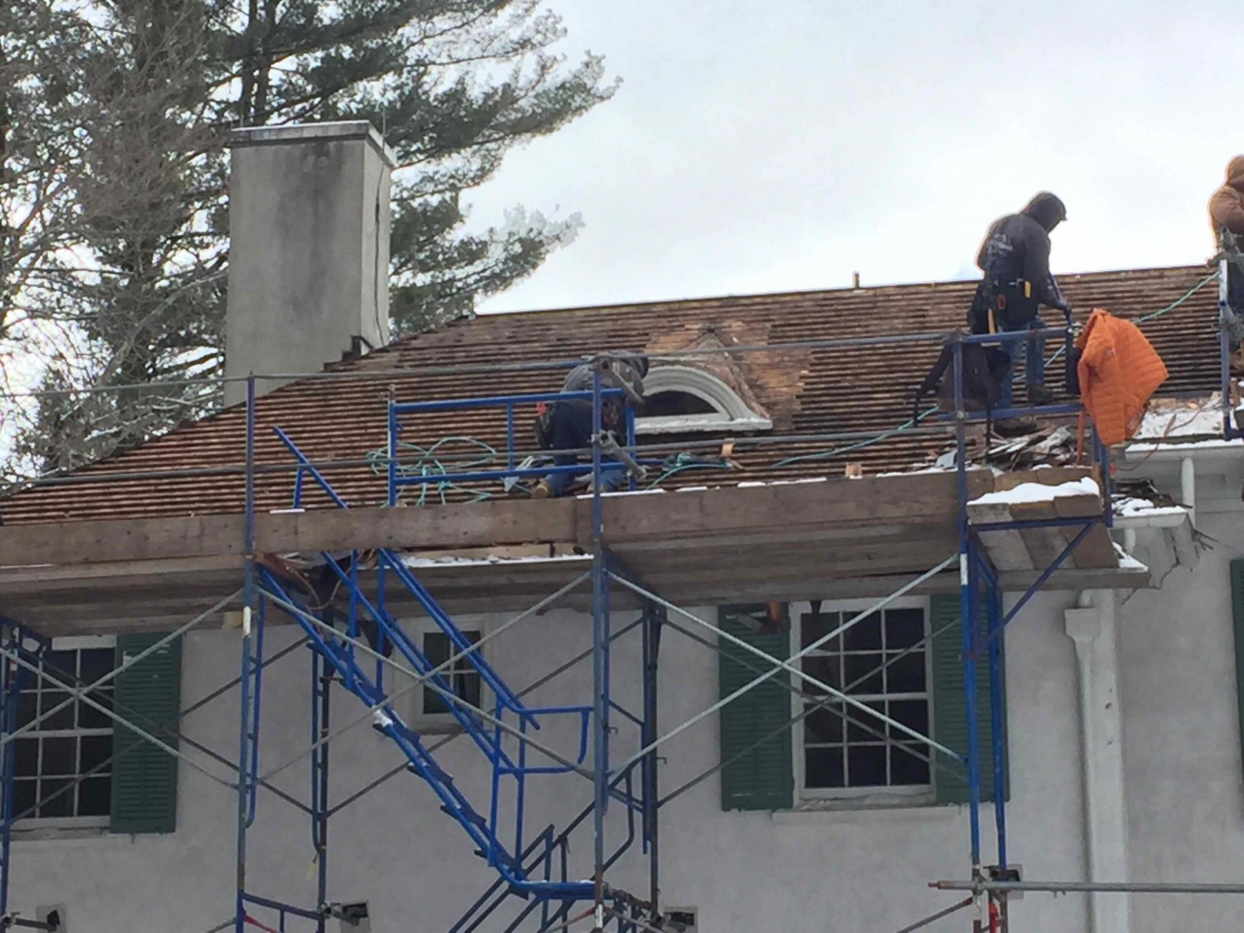 March 3 2022 reshingling on scaffolding.jpeg