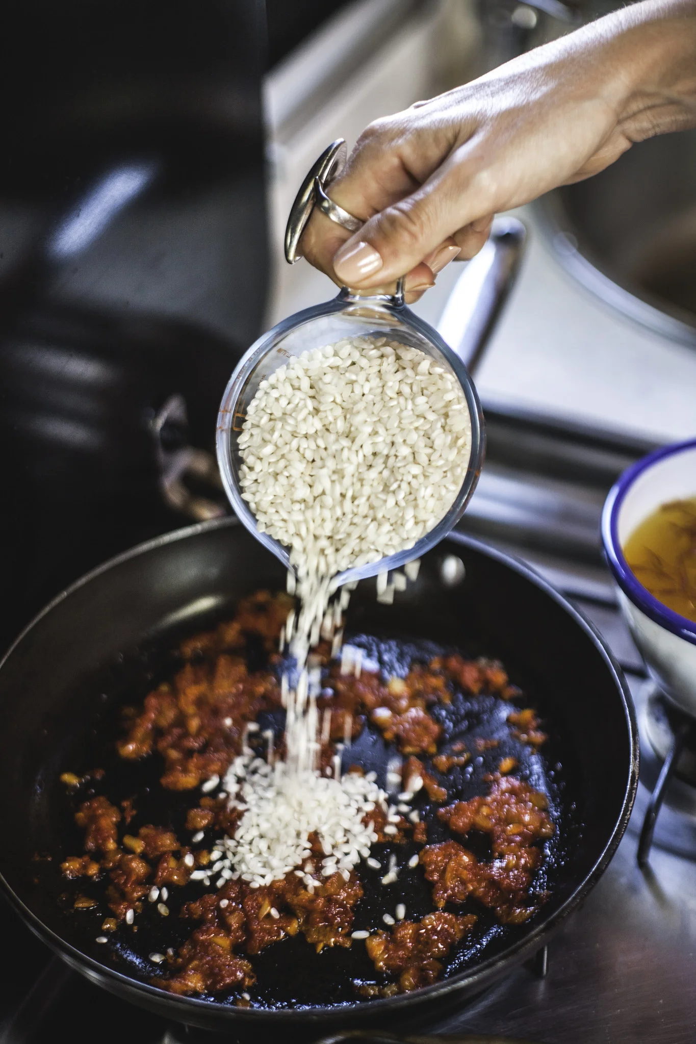 Add Bomba rice to your sofrito pan