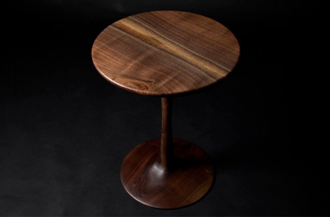sculpted walnut table