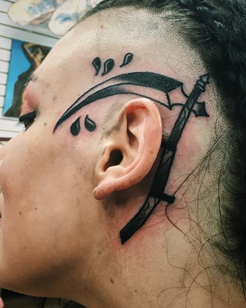 Traditional scythe tattoo by German