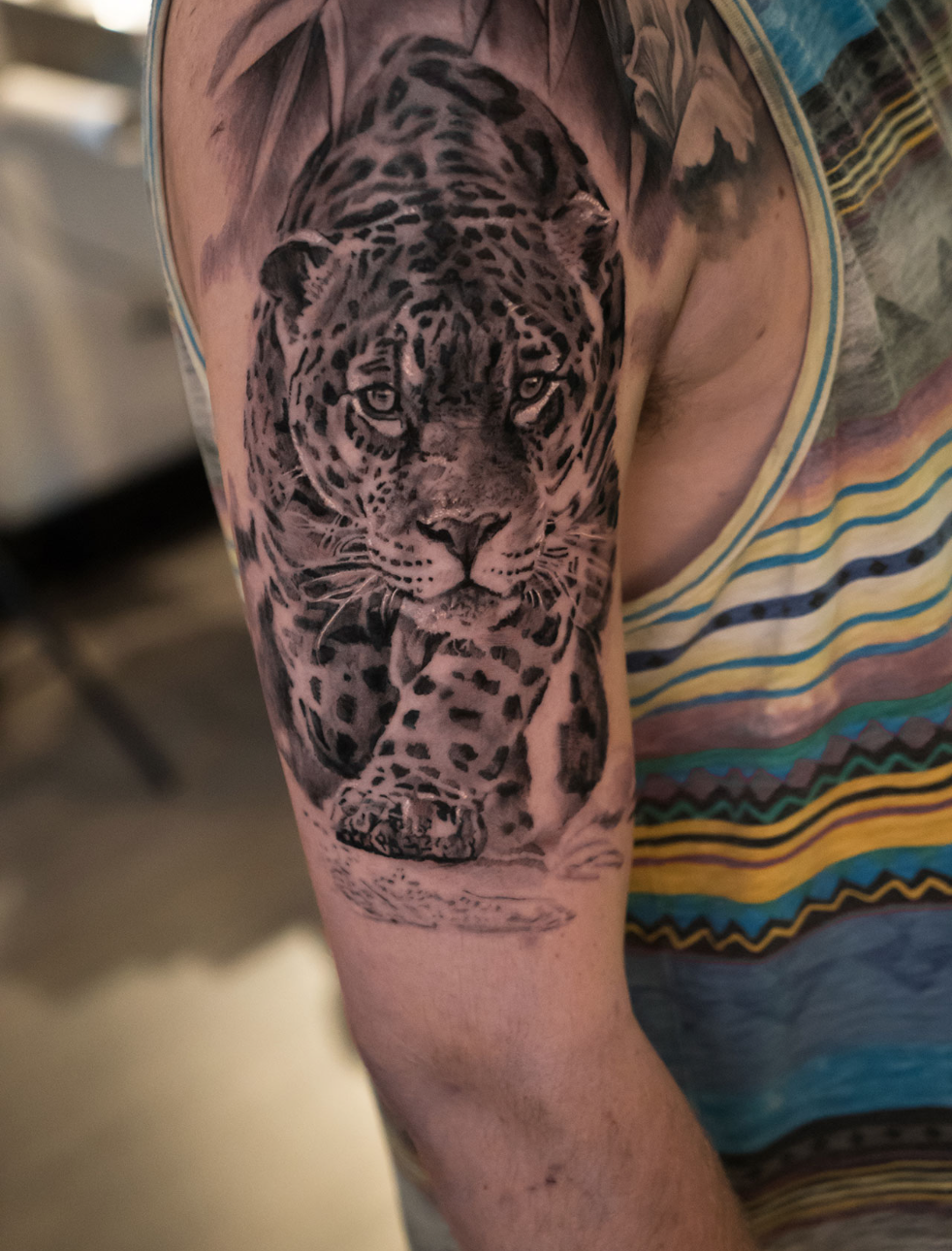Photorealistic jaguar tattoo by Scoot Ink