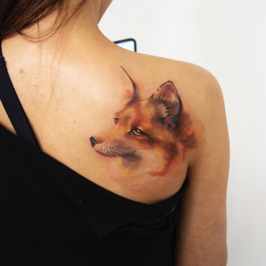 Realistic colour fox tattoo 