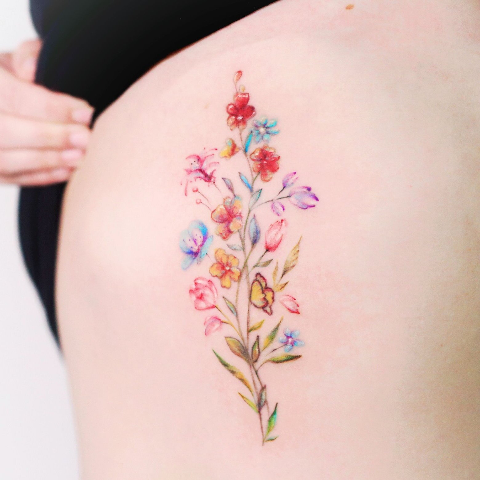Watercolour flower tattoo by Nico