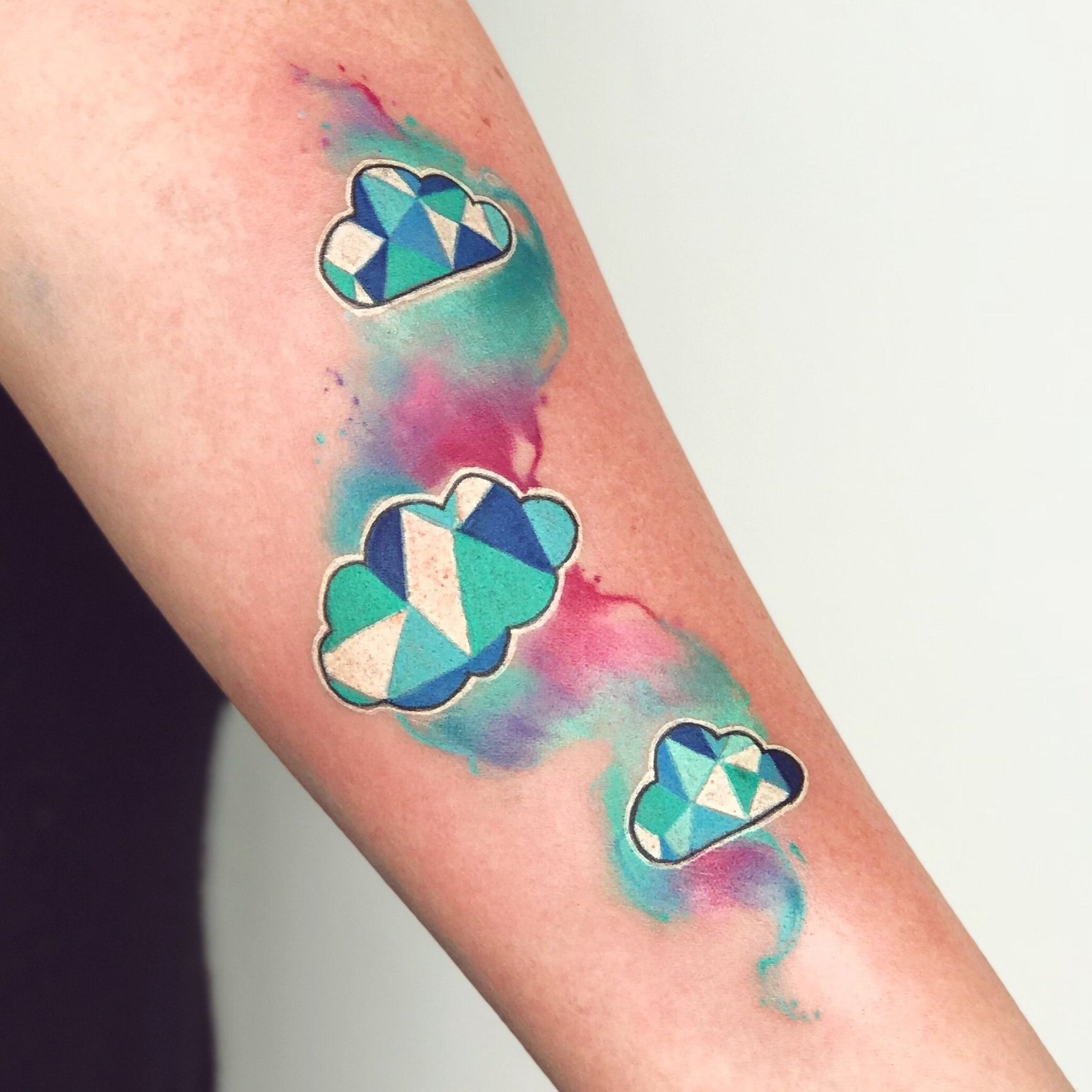 Watercolour cloud tattoo by Nico