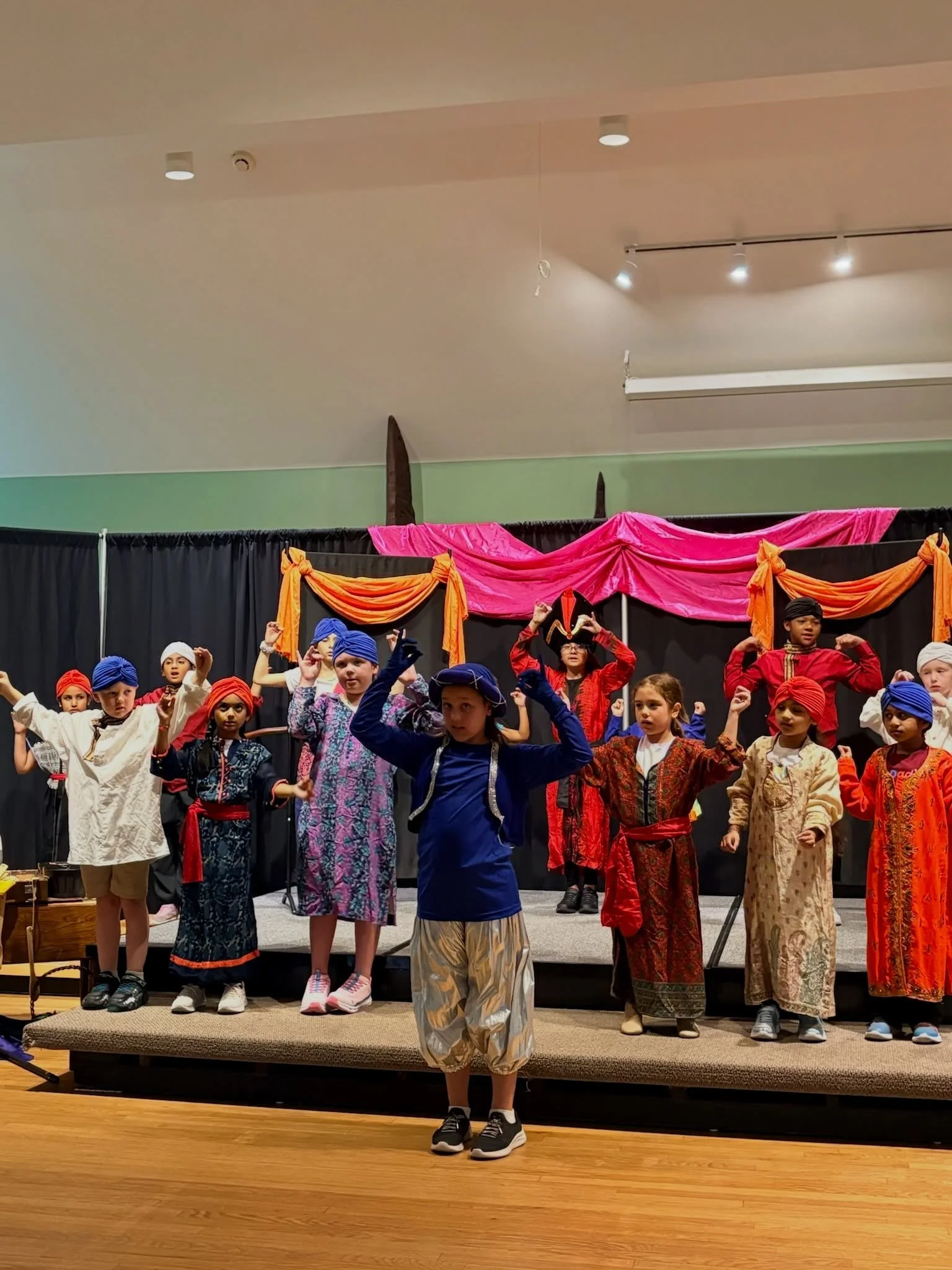This is what 5 days of Aladdin Jr. Musical Theatre camp can do.

On Monday, they walk in for role placement. Some are brand new. Some have performed before. Every camper gets a role, a script, and the chance to step into a character.

By Tuesday and 