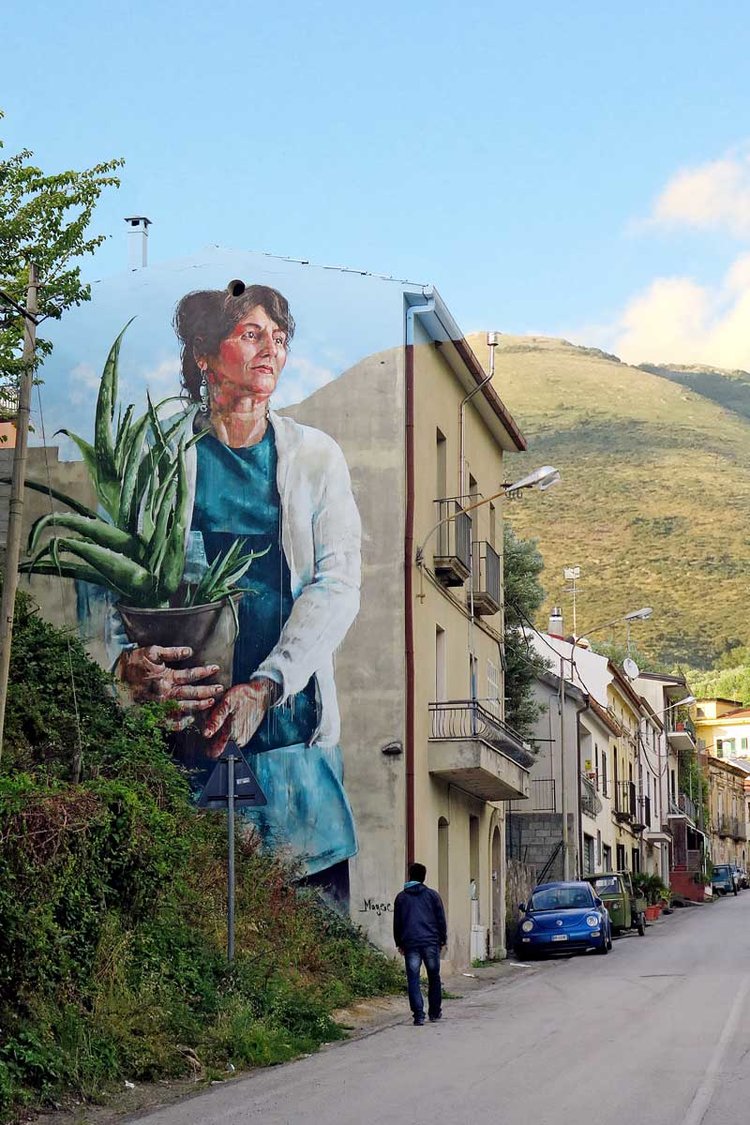 Woman with Aloe Vera plant by Fintan Magee