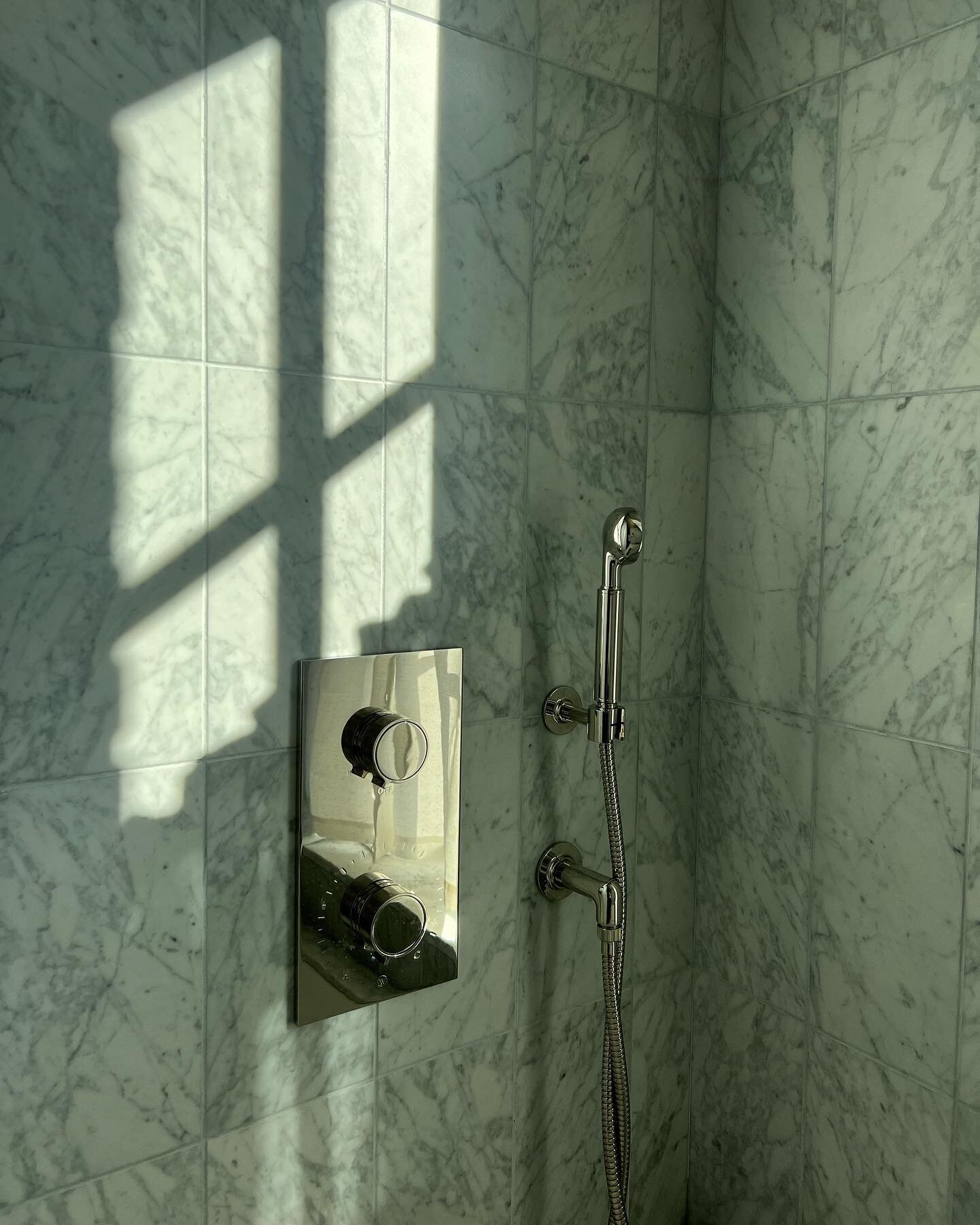 Classic carrara tile, a contemporary layout and polished streamlined fittings create a fresh yet timeless bathroom at our E10th Street duplex.

While this is a seemingly simple design with an inexpensive marble, the countless hours we spent on lot se