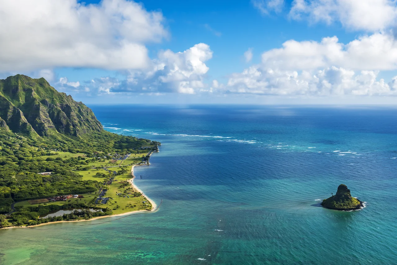 Part of the island of Oahu, which was formed from volcanic activity rather than the buildup of coral consistent with the formation of cayes.
