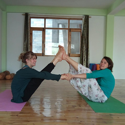 Julie (left) with her friend in the yoga studio