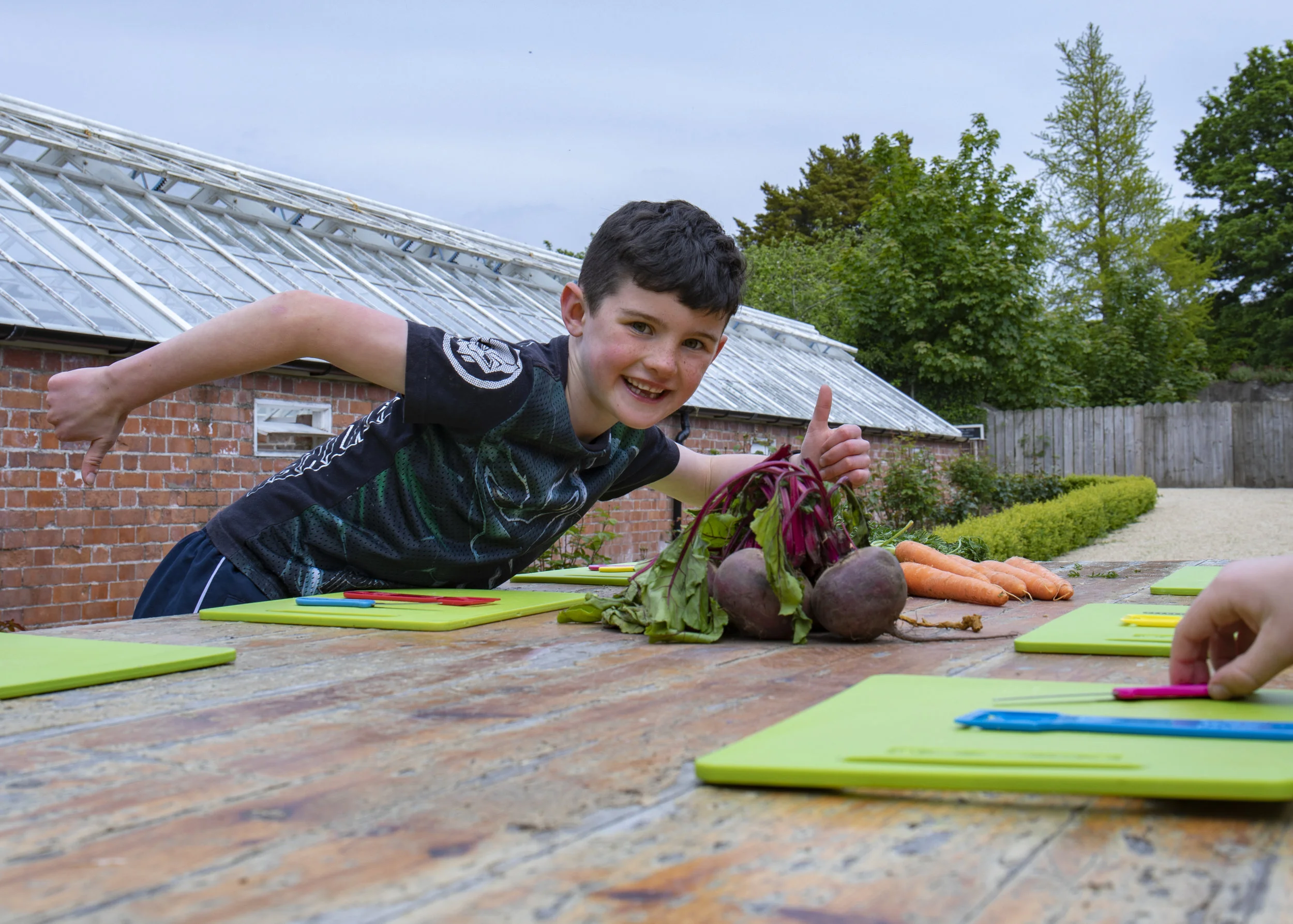boy with beetroot in Killruddery with the cool food school.jpg
