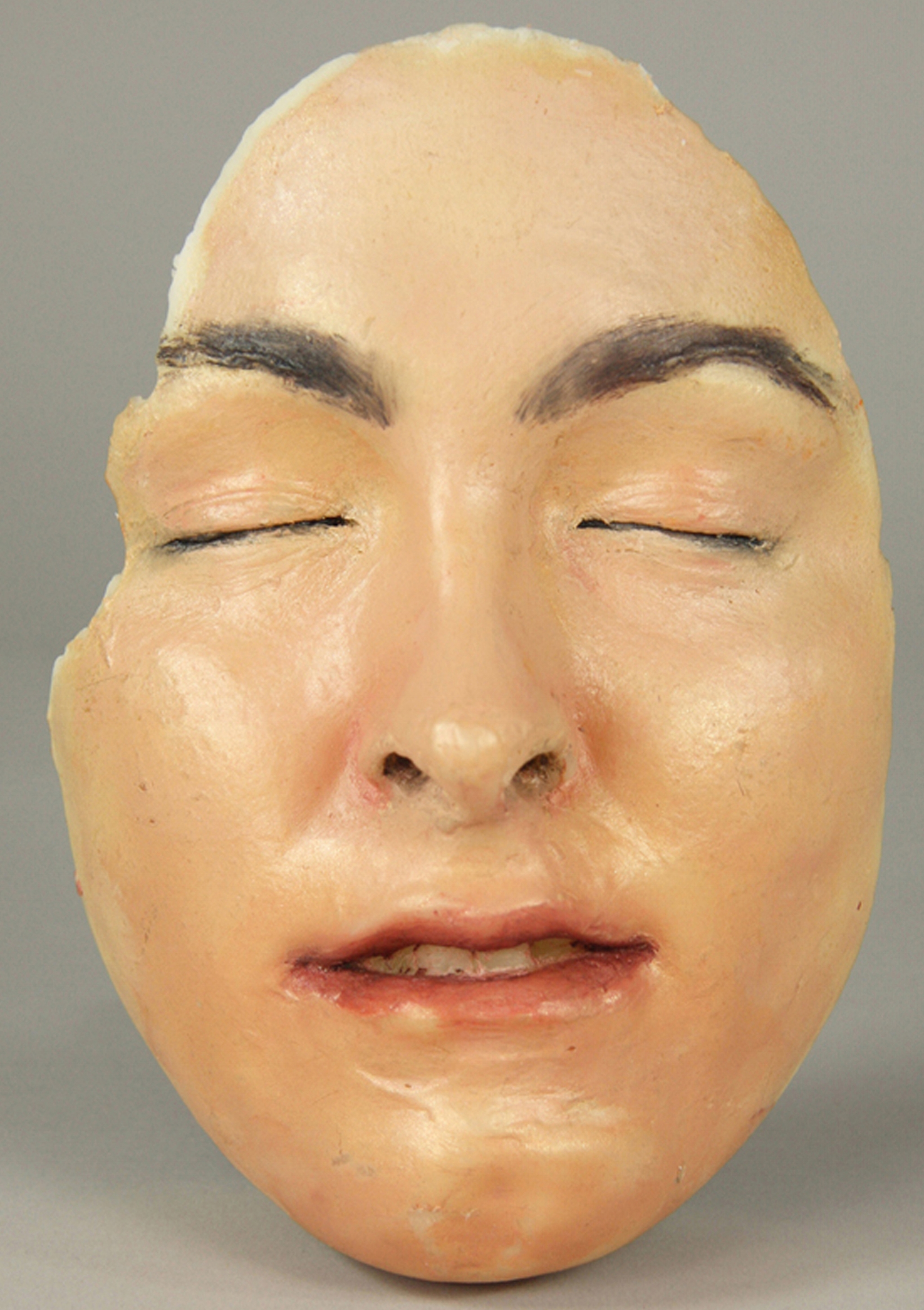 10. Mask of K. McGrath. Cast wax, oil paint, 8 ¼ “x 6” x 4”, 2011..jpg