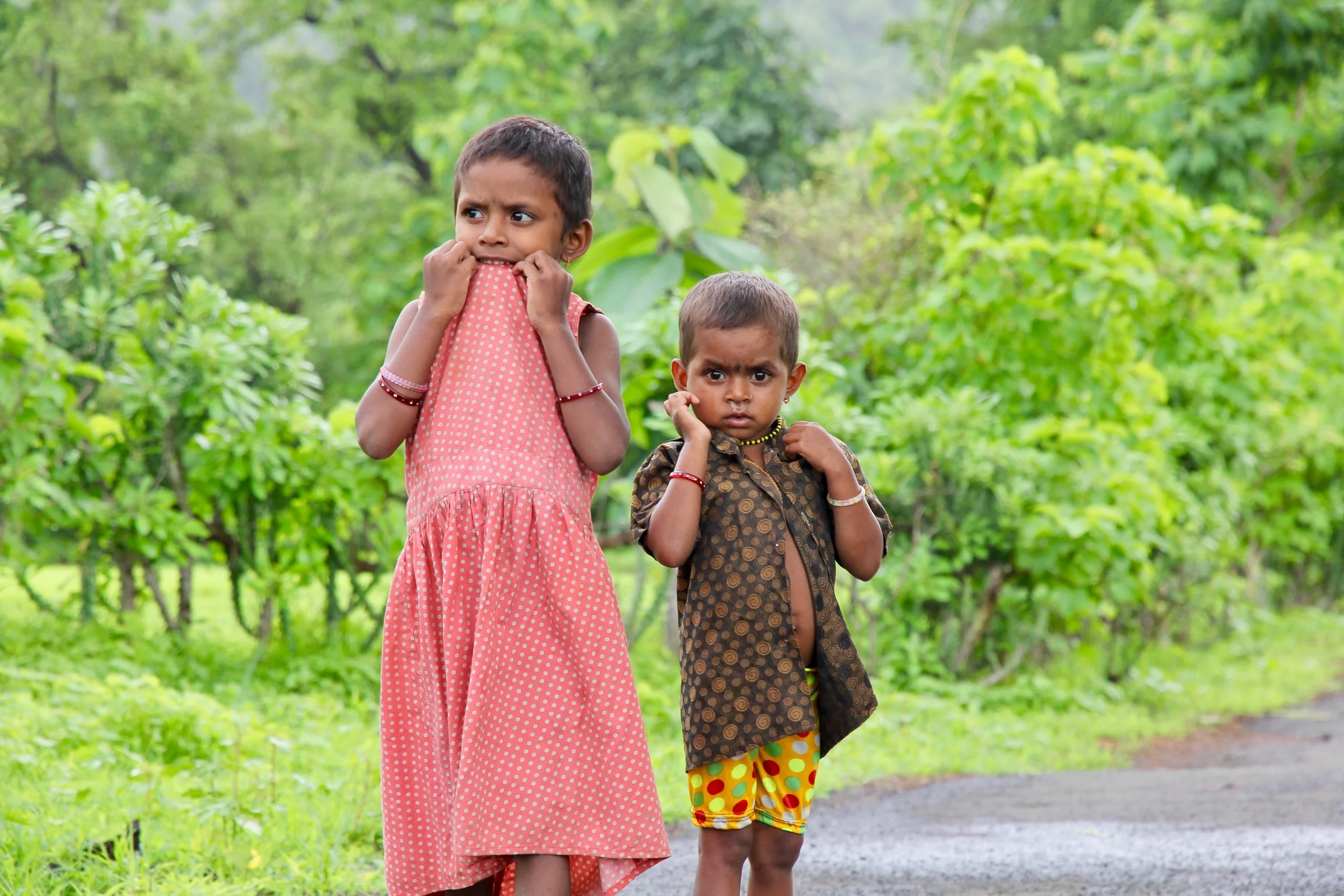 Every time I took out my camera, the villagers would run away laughing. Not these kids. They just stared back, defiantly.
