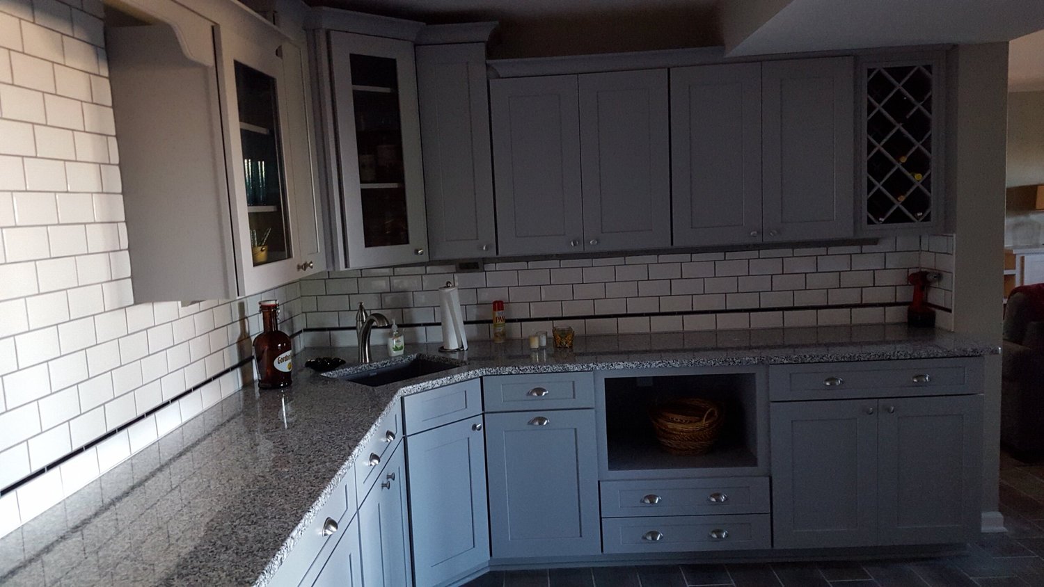 Kitchen design and remodeling Syracuse NY L-shaped white kitchen with tile backsplash